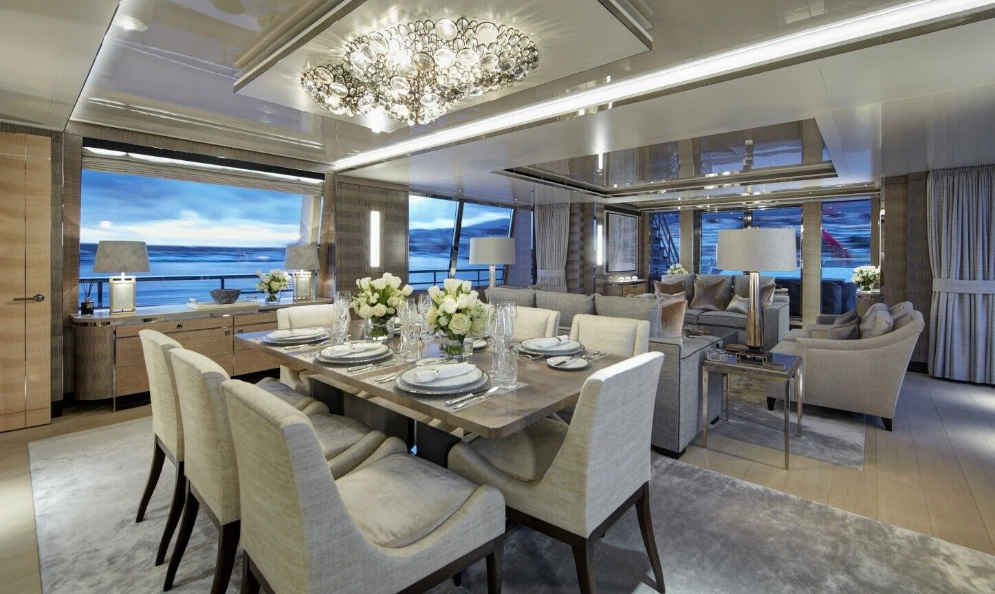 a large living room with a large chandelier aboard LADY VICTORIA Yacht for Sale