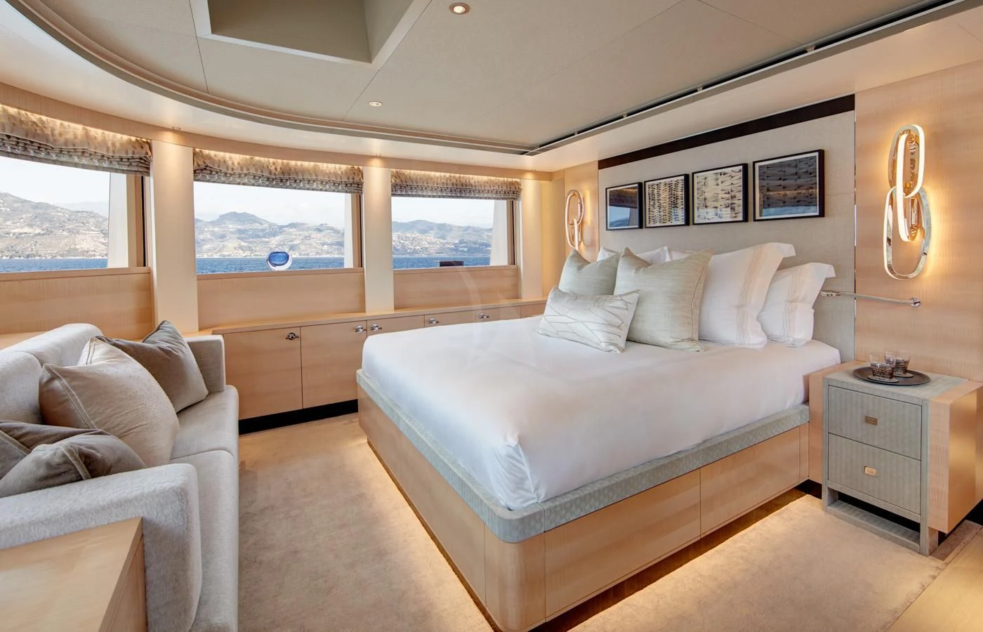 a bedroom with a bed and a couch aboard LADY VICTORIA Yacht for Sale