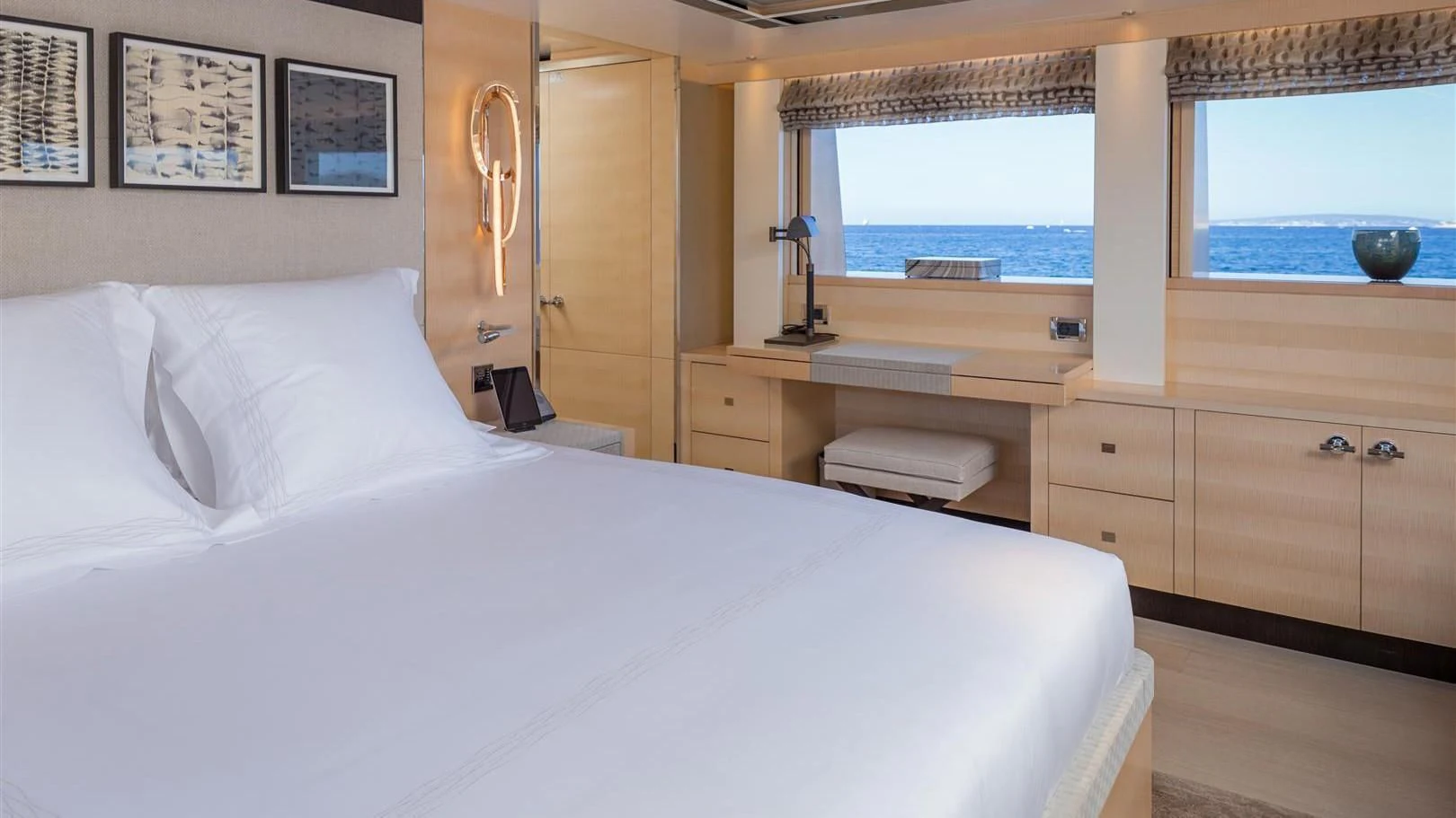 a bed with white sheets aboard LADY VICTORIA Yacht for Sale