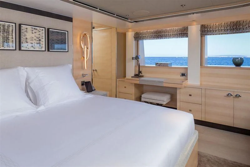 a bedroom with a large bed aboard LADY VICTORIA Yacht for Sale
