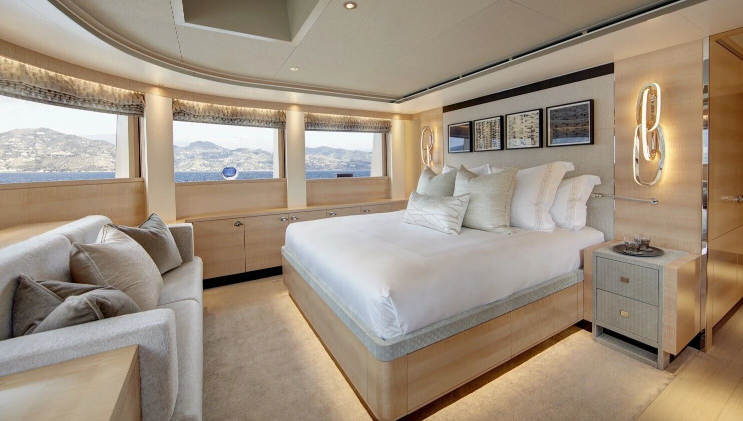 a bedroom with a bed and a couch aboard LADY VICTORIA Yacht for Sale
