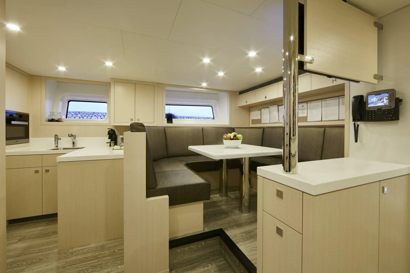 a kitchen with a couch and a table aboard LADY VICTORIA Yacht for Sale