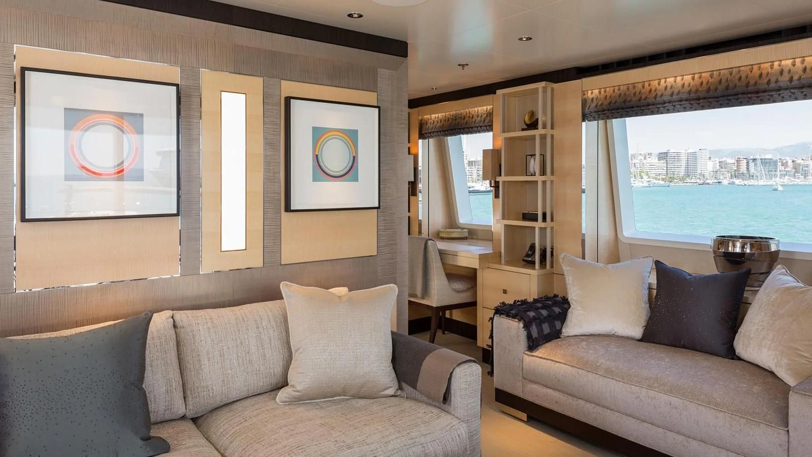 a living room with a couch and a window aboard LADY VICTORIA Yacht for Sale