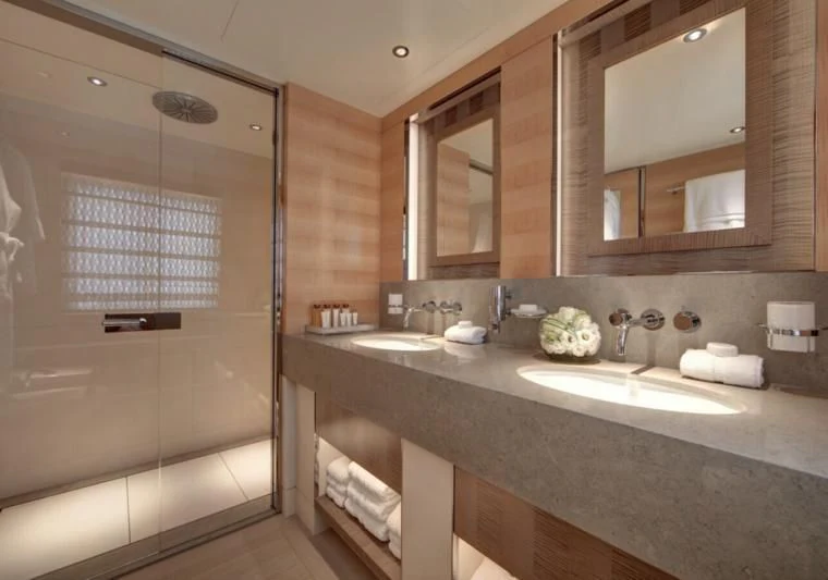 a bathroom with a glass shower aboard LADY VICTORIA Yacht for Sale