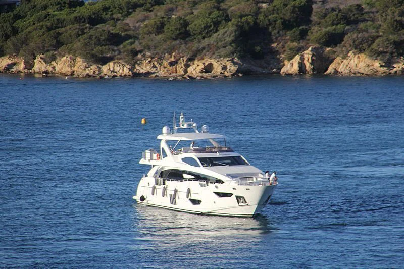 a white boat on the water aboard MR. FRANCISCO Yacht for Sale