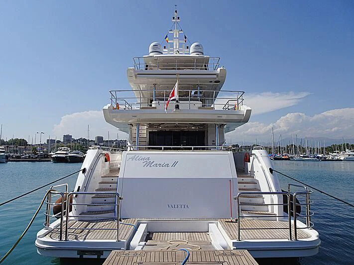 a large white boat on a dock aboard ALINA MARIA II Yacht for Sale