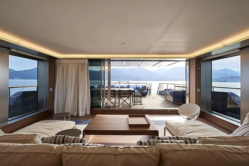 a living room with a large window aboard OCEAN'S FOUR Yacht for Sale