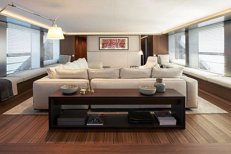 a living room with a couch and coffee table aboard OCEAN'S FOUR Yacht for Sale