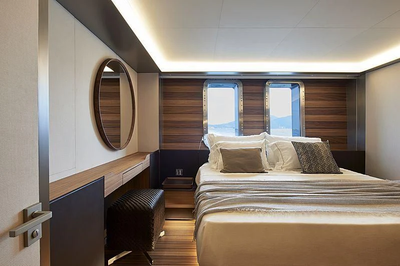 a bed with a mirror above it aboard OCEAN'S FOUR Yacht for Sale