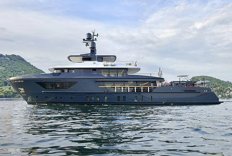 a large boat on the water aboard OCEAN'S FOUR Yacht for Sale
