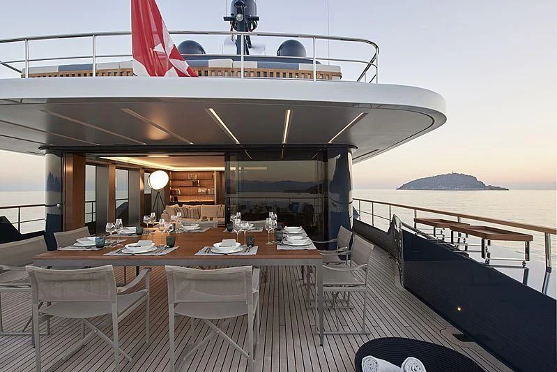 a large boat on a body of water aboard OCEAN'S FOUR Yacht for Sale