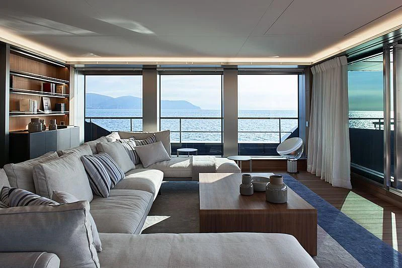 a living room with a large window aboard OCEAN'S FOUR Yacht for Sale