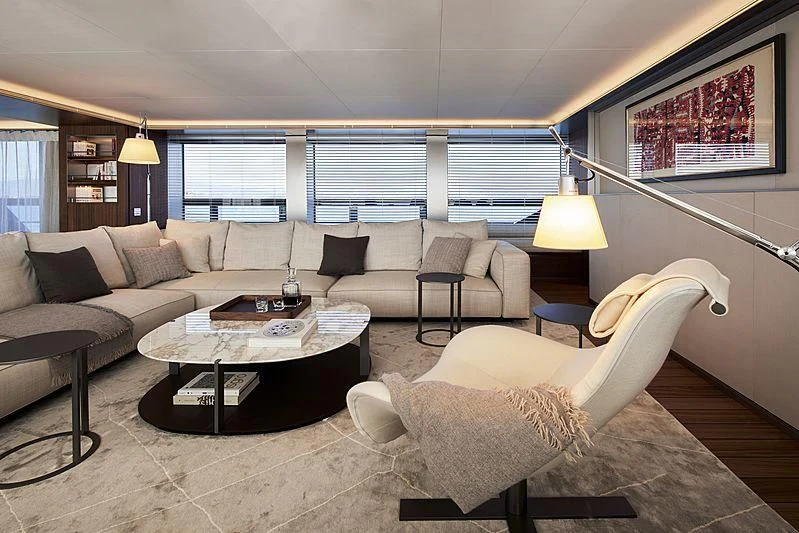 a living room with a couch and a table aboard OCEAN'S FOUR Yacht for Sale