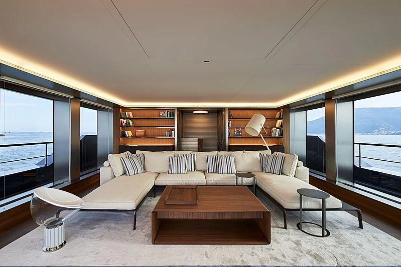 a living room with a large window aboard OCEAN'S FOUR Yacht for Sale