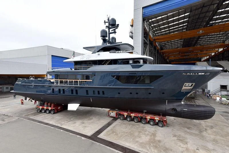 a large airplane is parked in a hangar aboard OCEAN'S FOUR Yacht for Sale