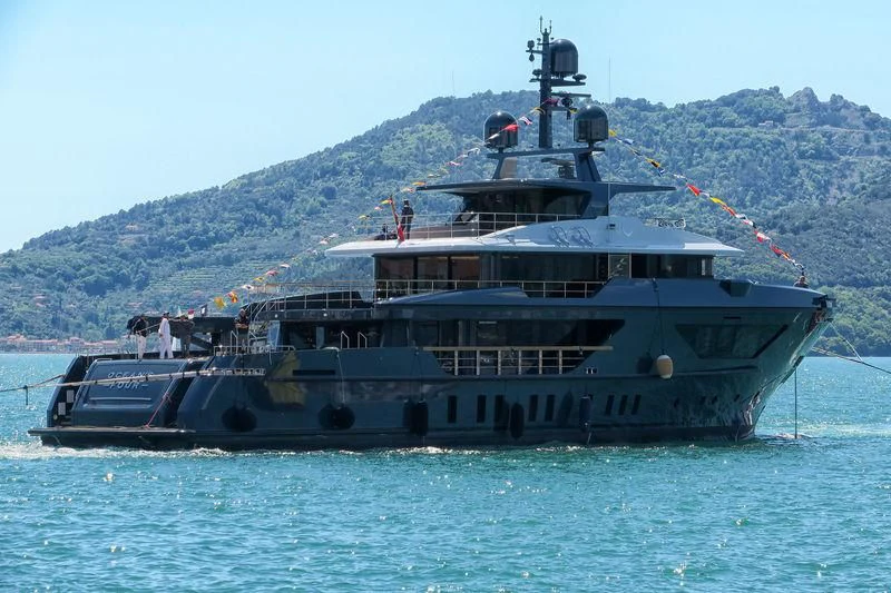 a large boat on the water aboard OCEAN'S FOUR Yacht for Sale