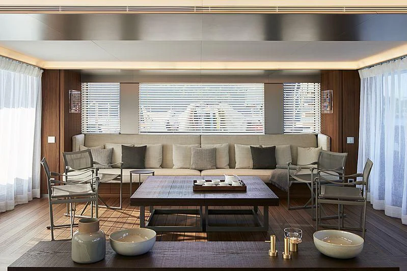 a living room with a couch and a table aboard OCEAN'S FOUR Yacht for Sale
