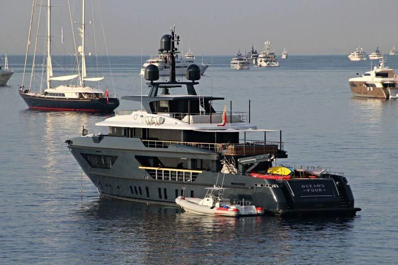 a large boat in the water aboard OCEAN'S FOUR Yacht for Sale