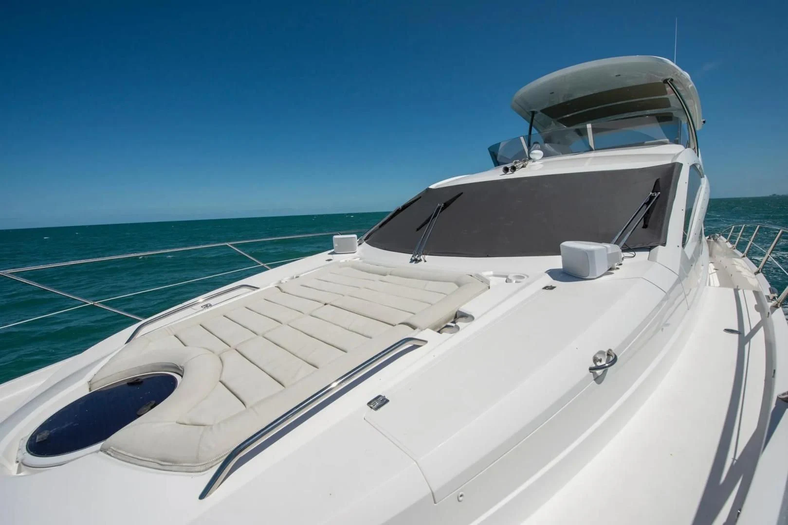 a white boat on the water aboard LIQUIDITY Yacht for Sale