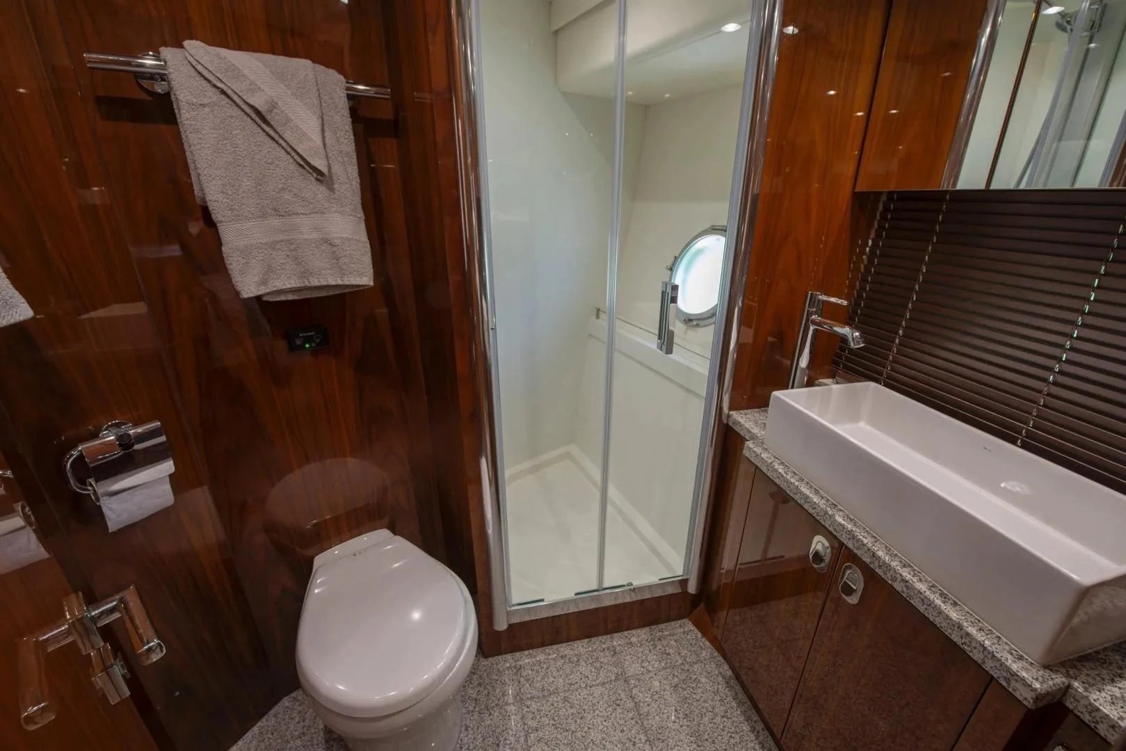 a bathroom with a tub toilet and sink aboard LIQUIDITY Yacht for Sale