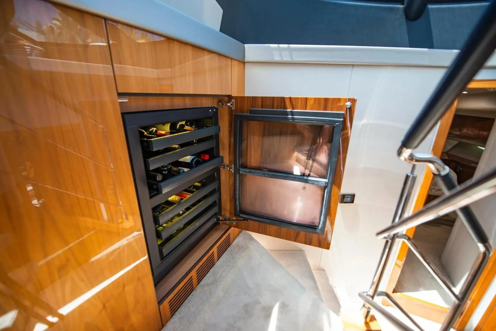 a room with a tv and a ladder aboard LIQUIDITY Yacht for Sale