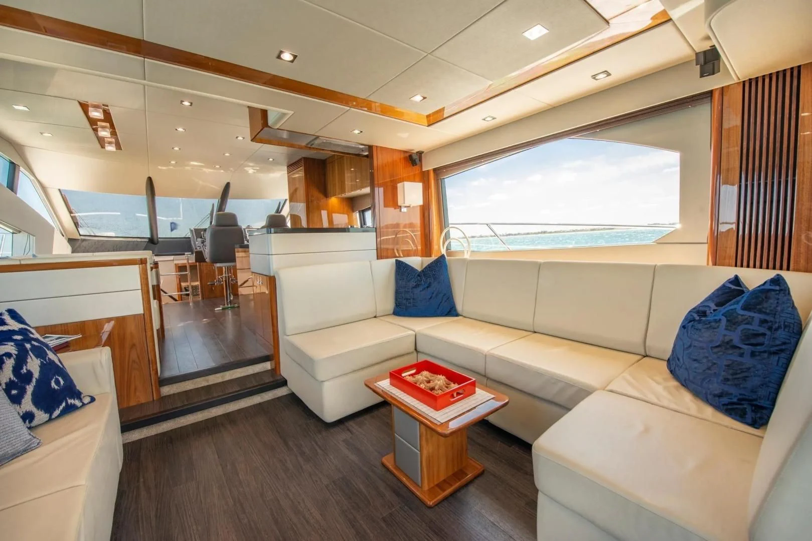 a living room with a couch and a table aboard LIQUIDITY Yacht for Sale