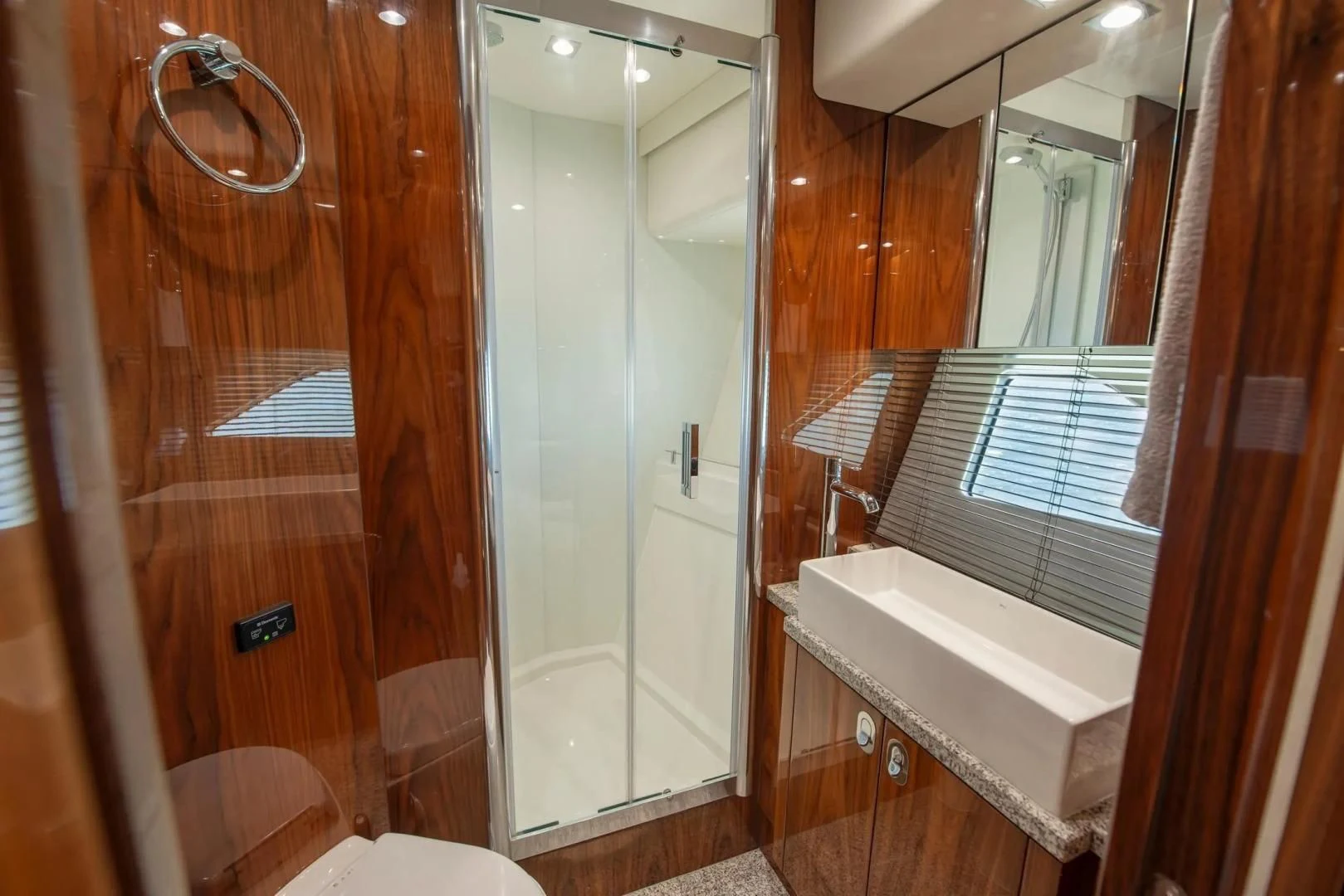 a bathroom with a glass shower aboard LIQUIDITY Yacht for Sale