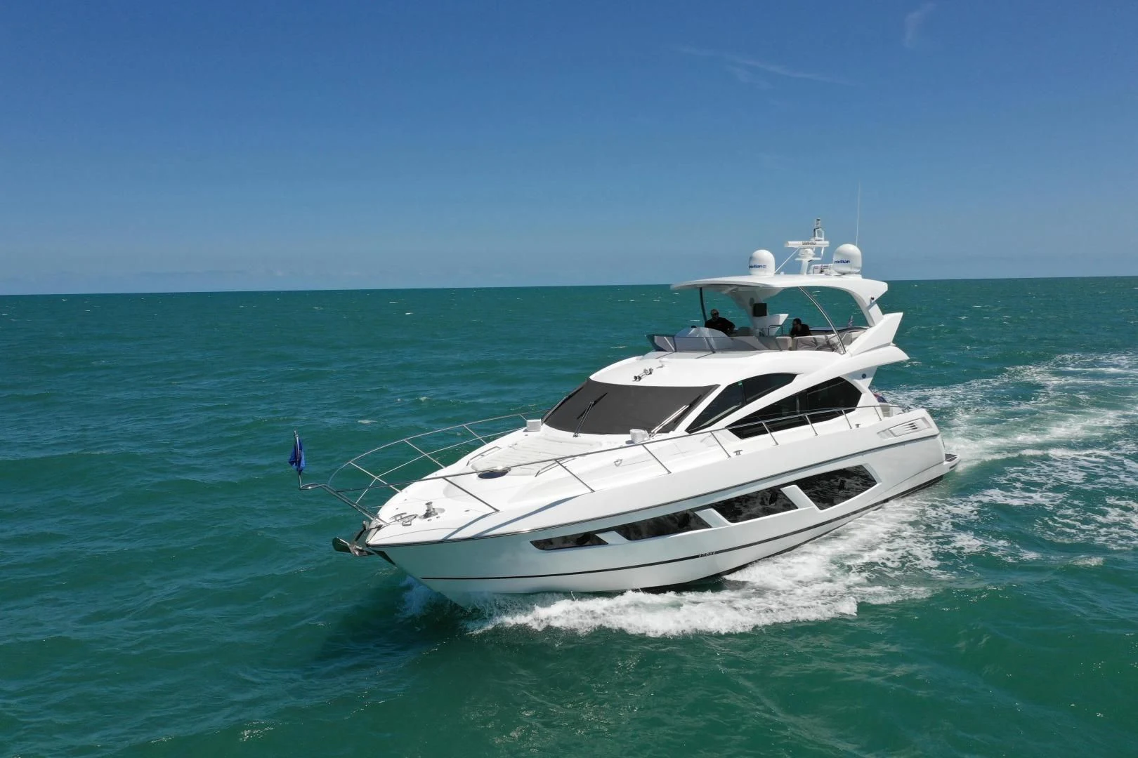 a white yacht in the ocean aboard LIQUIDITY Yacht for Sale