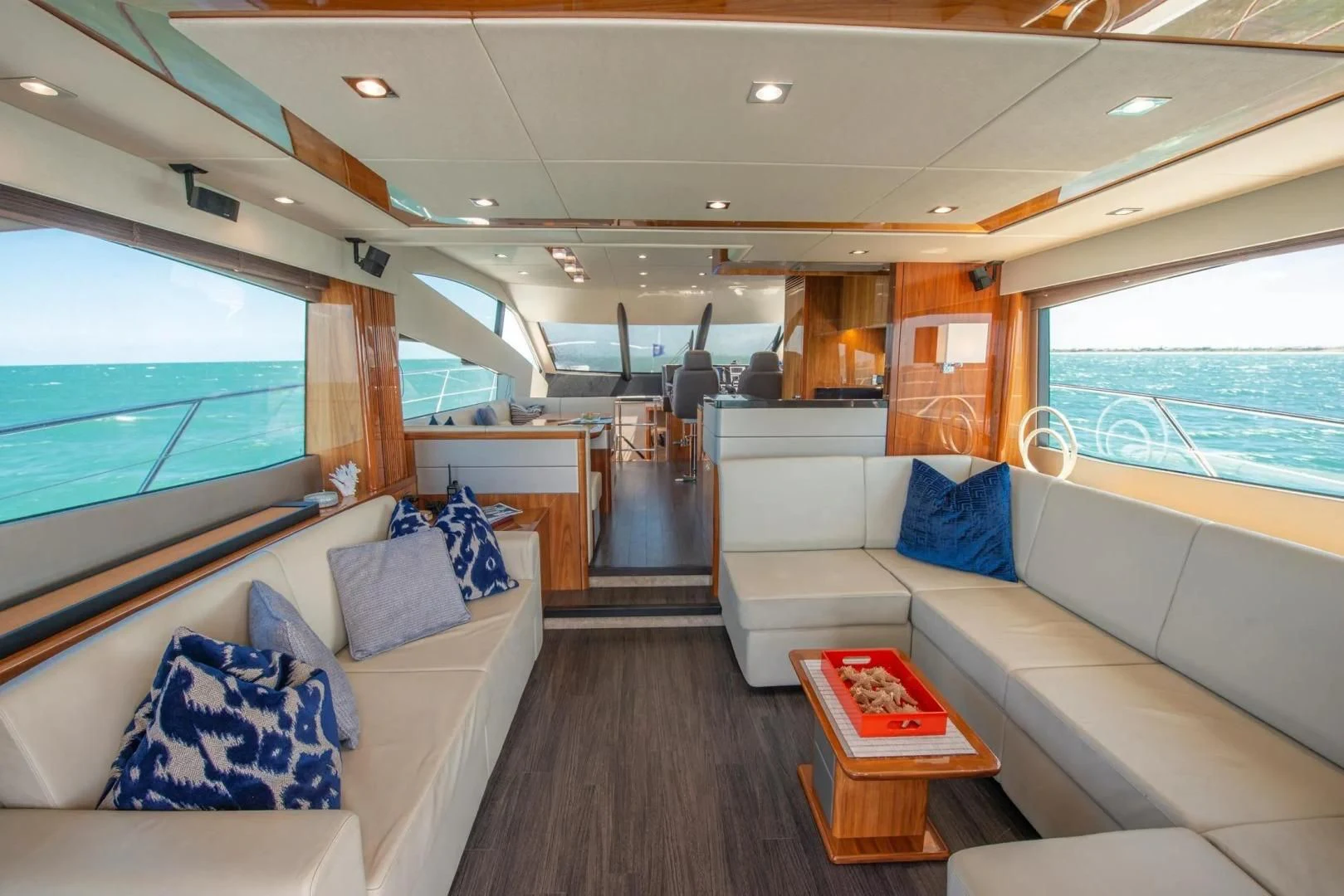 a living room with a large window aboard LIQUIDITY Yacht for Sale