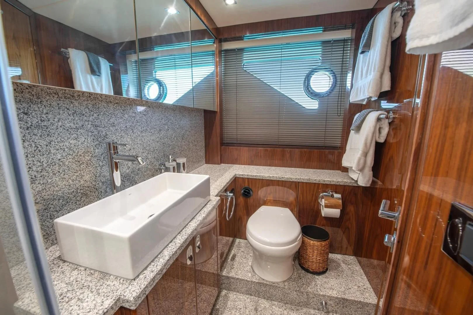 a bathroom with a sink toilet and a bathtub aboard LIQUIDITY Yacht for Sale