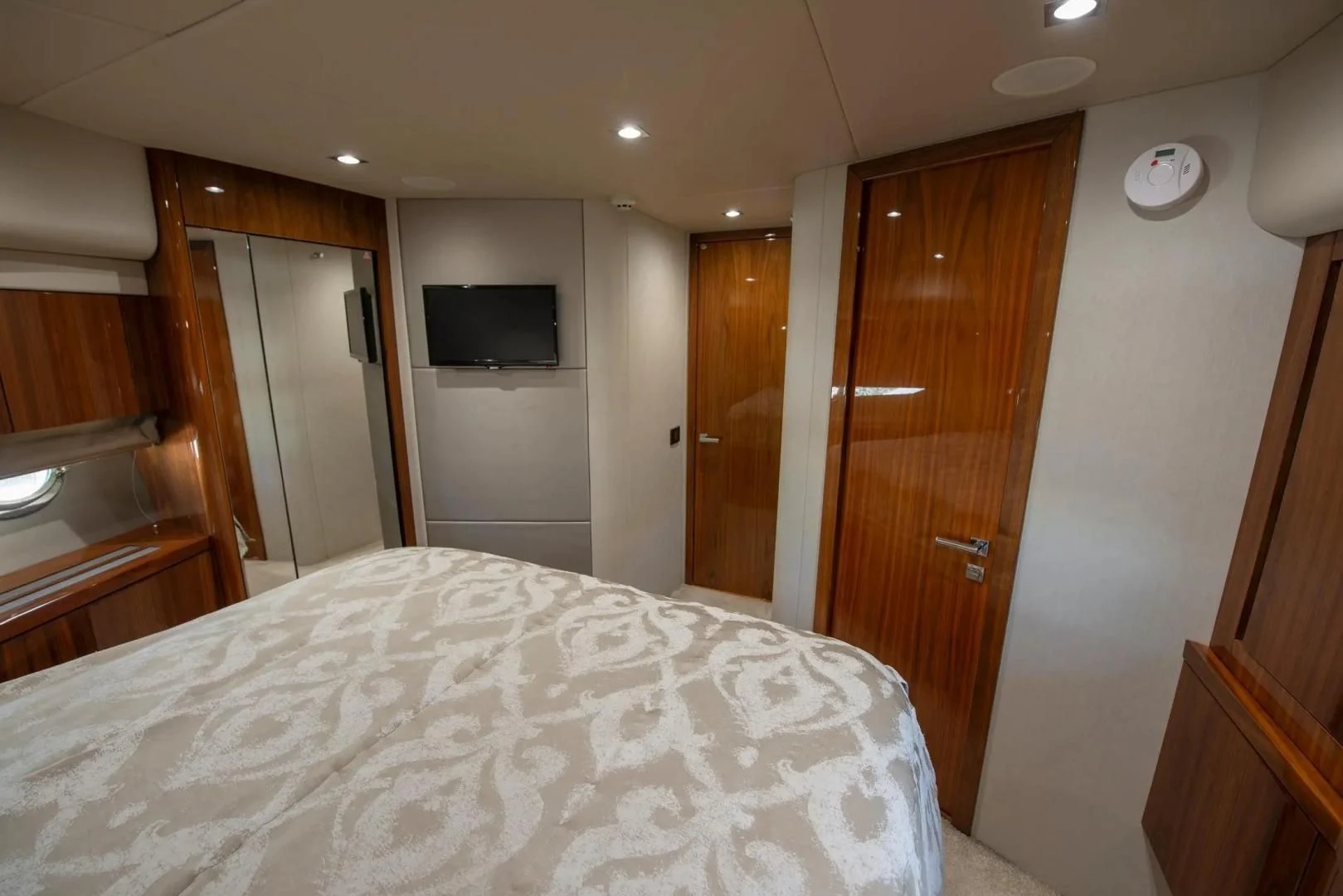 a bedroom with a bed aboard LIQUIDITY Yacht for Sale