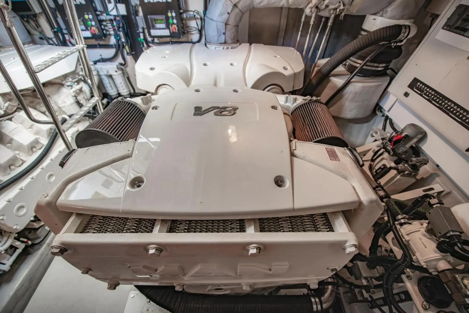 a white car in a factory aboard LIQUIDITY Yacht for Sale