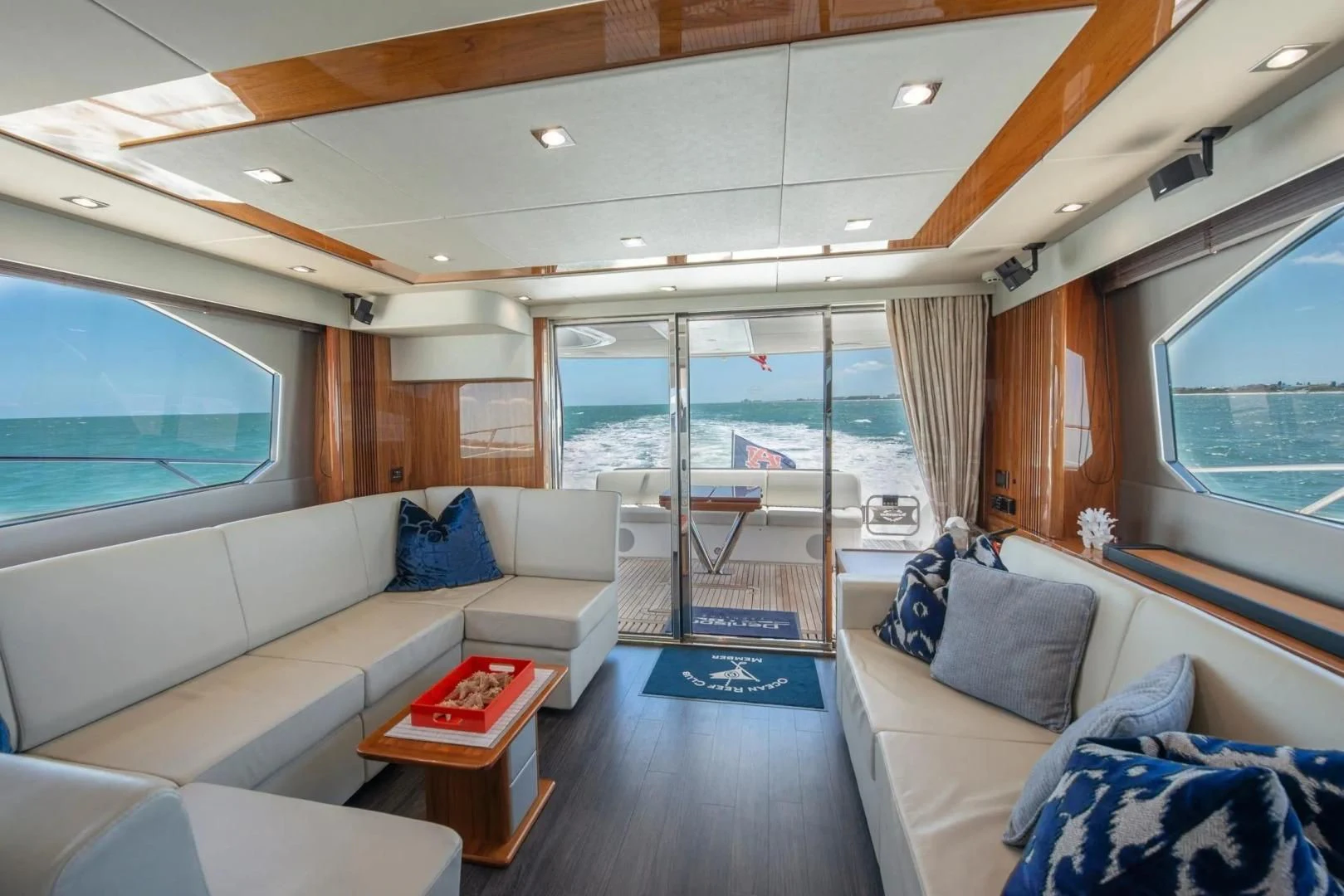 a living room with a large window aboard LIQUIDITY Yacht for Sale