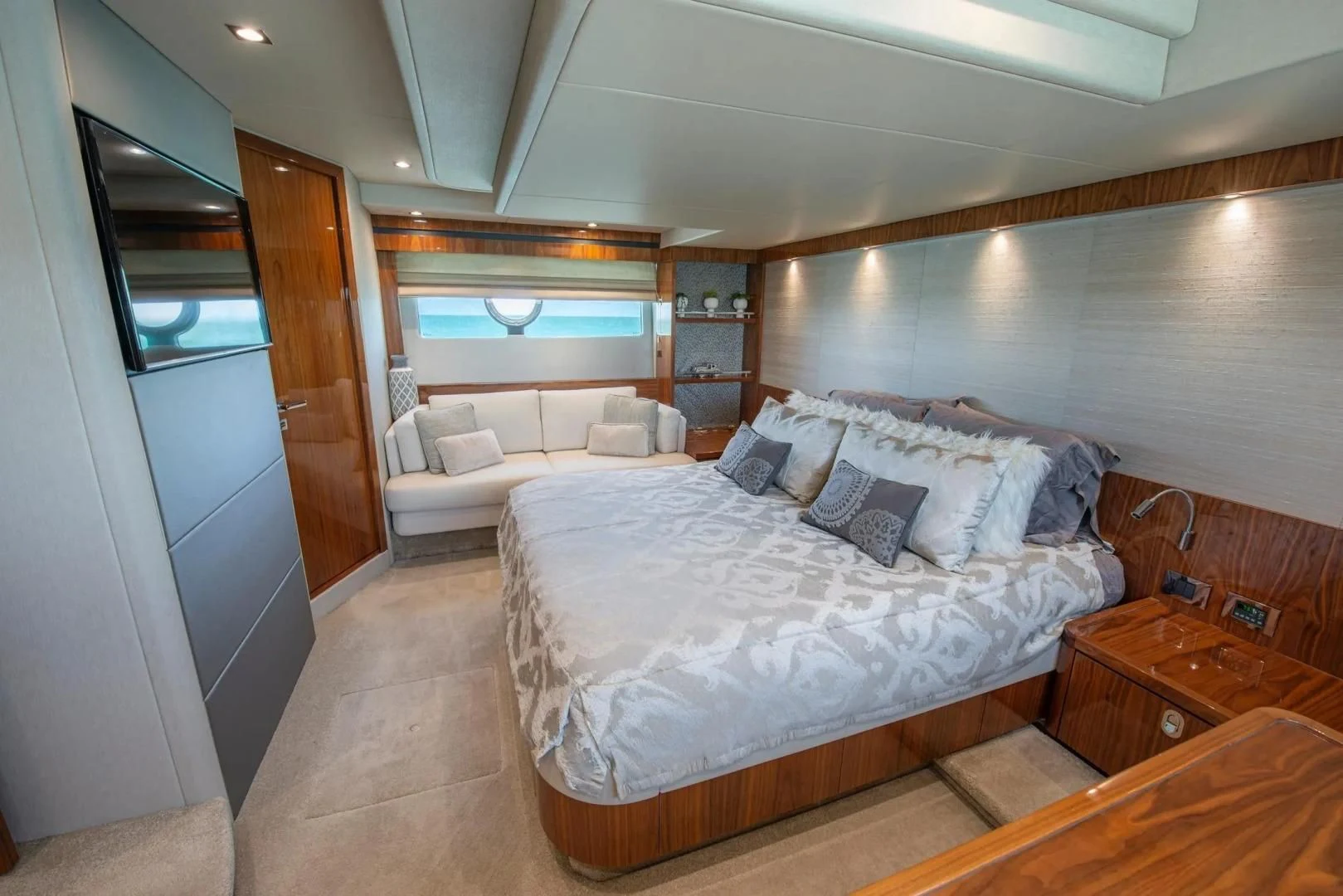 a large bedroom with a bed aboard LIQUIDITY Yacht for Sale