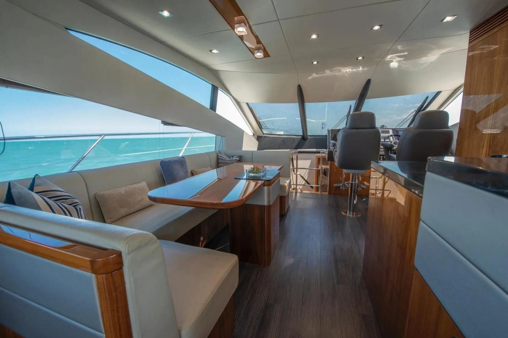 inside of a vehicle with a table and chairs and a pool table aboard LIQUIDITY Yacht for Sale