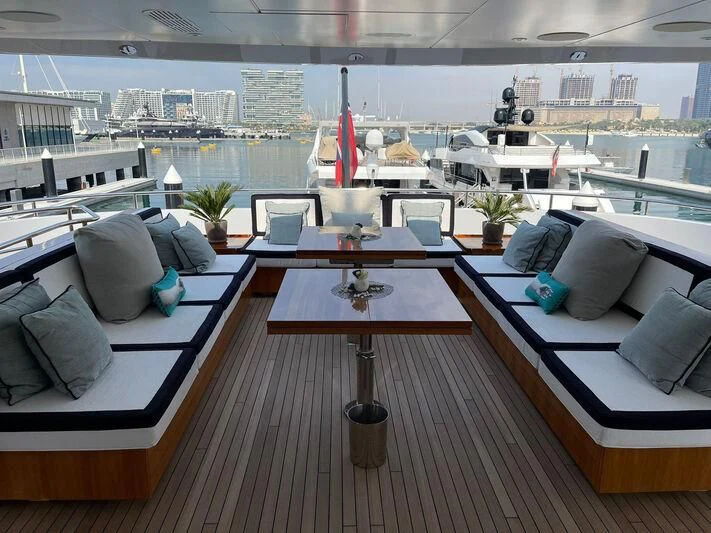 a room with a table and chairs aboard ROCKET Yacht for Sale