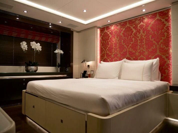 a bed with white sheets aboard ROCKET Yacht for Sale