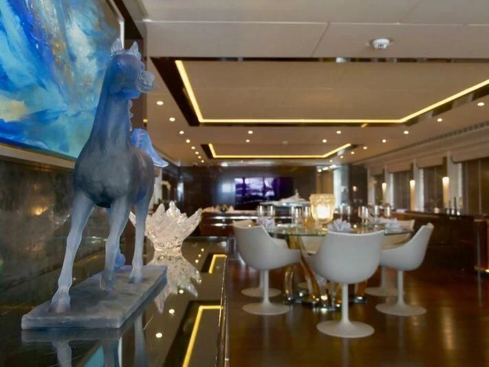 a dinosaur skeleton in a restaurant aboard ROCKET Yacht for Sale