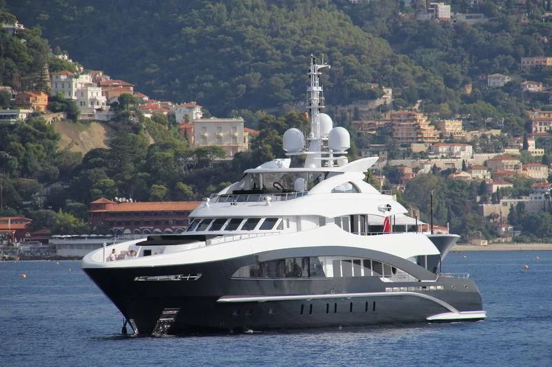 a large white yacht on the water aboard ROCKET Yacht for Sale