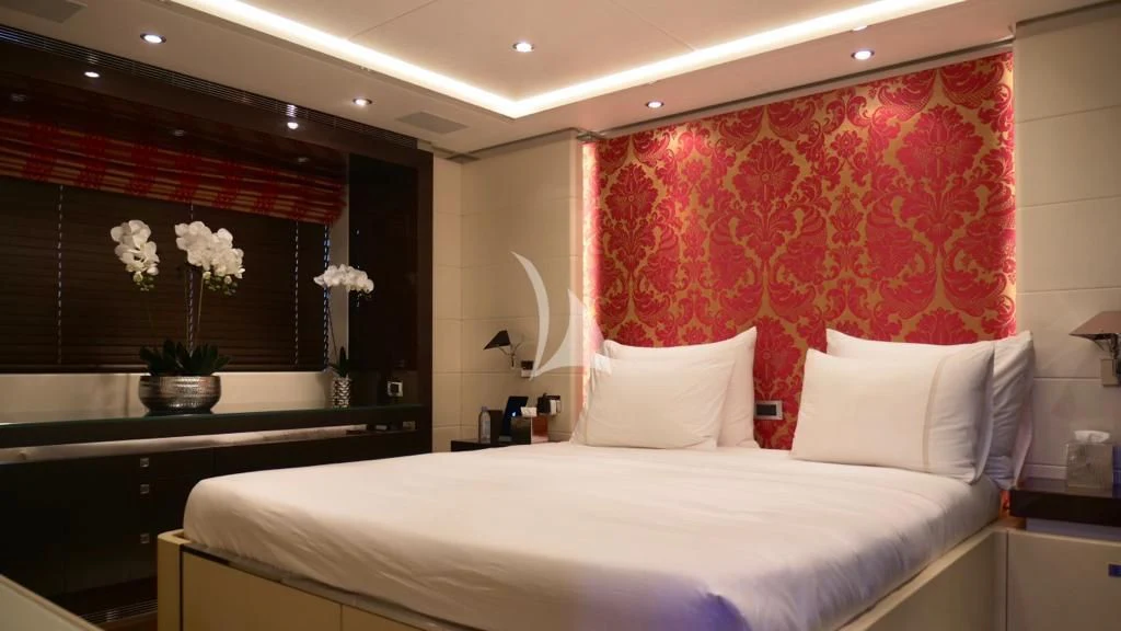 a bed with white sheets aboard ROCKET Yacht for Sale
