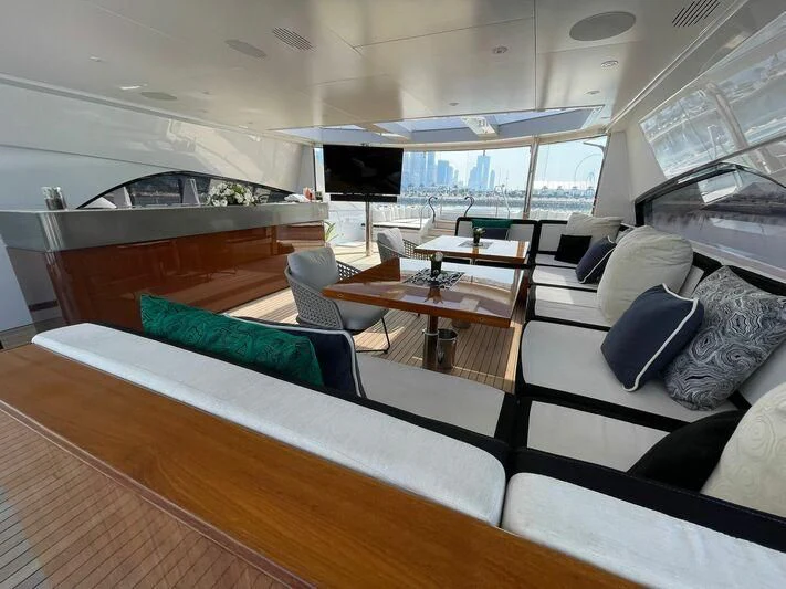 a room with a couch and a table aboard ROCKET Yacht for Sale