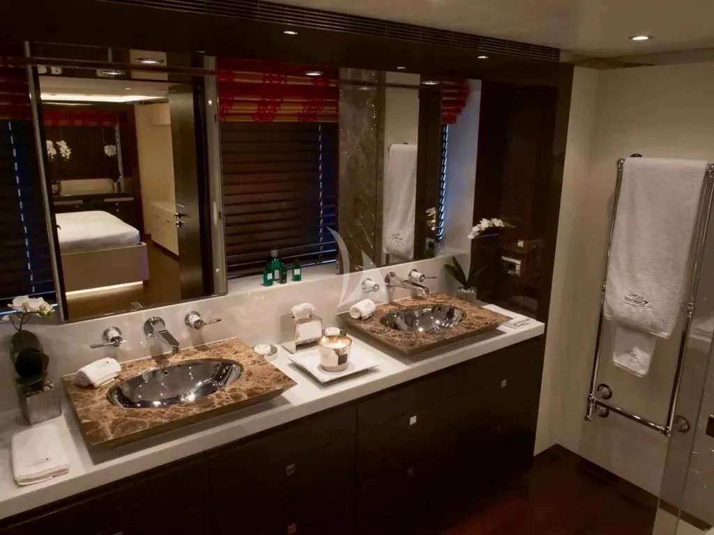 a bathroom with a sink and a mirror aboard ROCKET Yacht for Sale