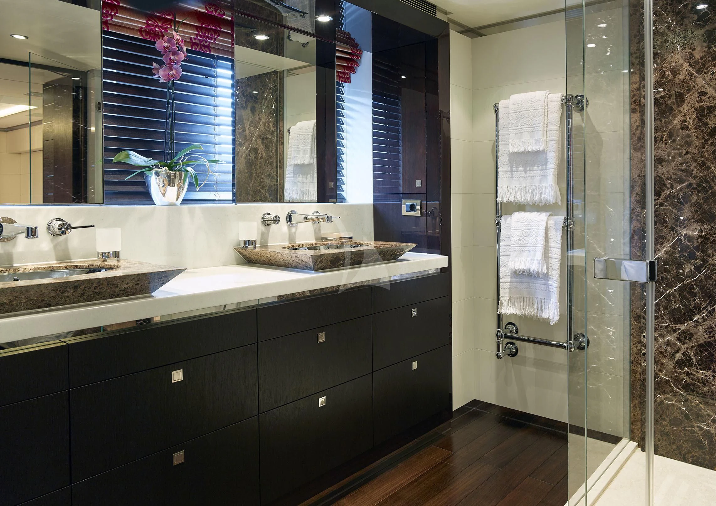 a bathroom with a glass shower aboard ROCKET Yacht for Sale