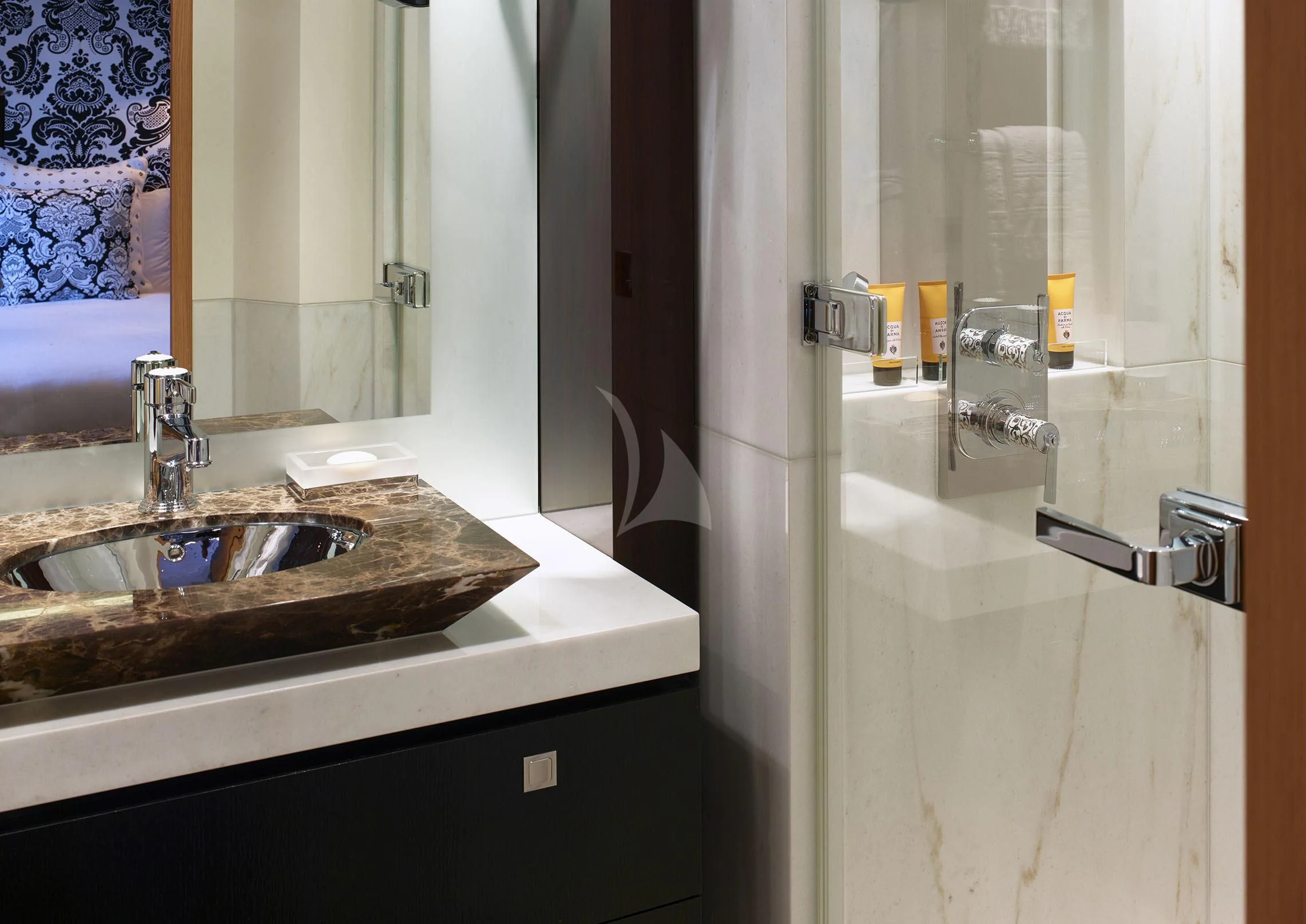 a bathroom with a sink and a mirror aboard ROCKET Yacht for Sale