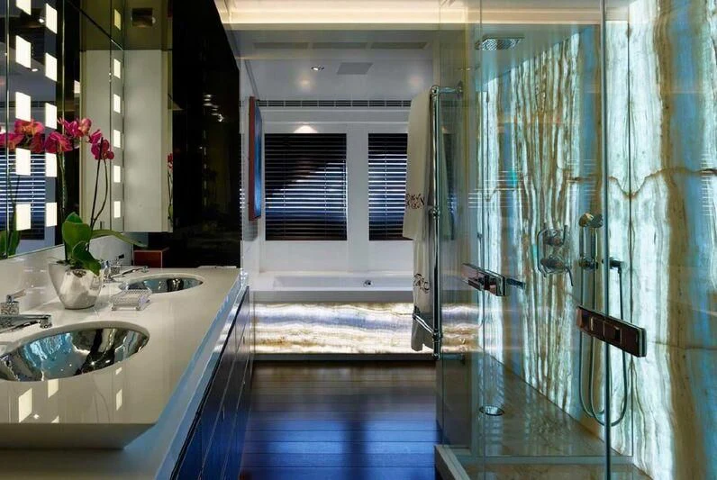 a bathroom with a shower curtain aboard ROCKET Yacht for Sale
