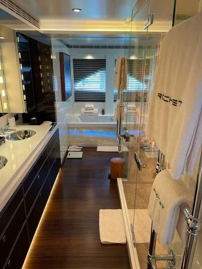a bathroom with a large mirror aboard ROCKET Yacht for Sale