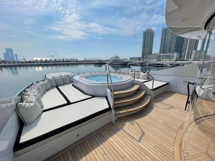 a deck with a view of a city and a large body of water aboard ROCKET Yacht for Sale
