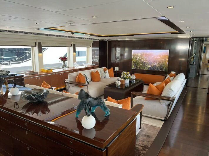 a living room with a large window aboard ROCKET Yacht for Sale