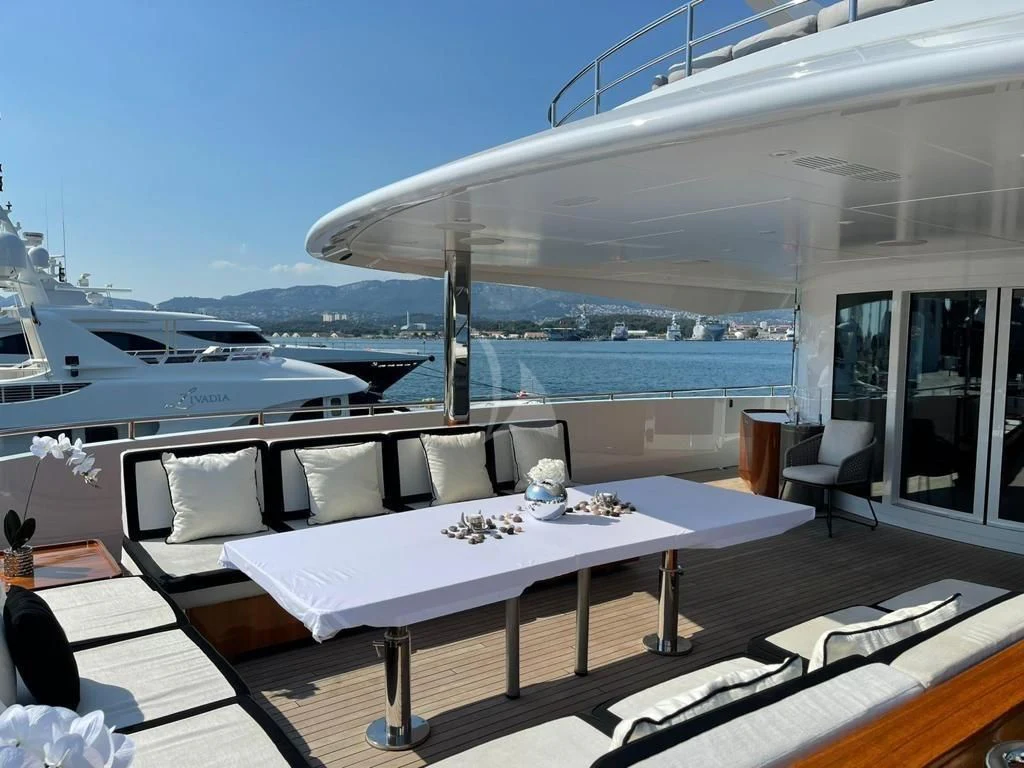 a room with a table and chairs aboard ROCKET Yacht for Sale