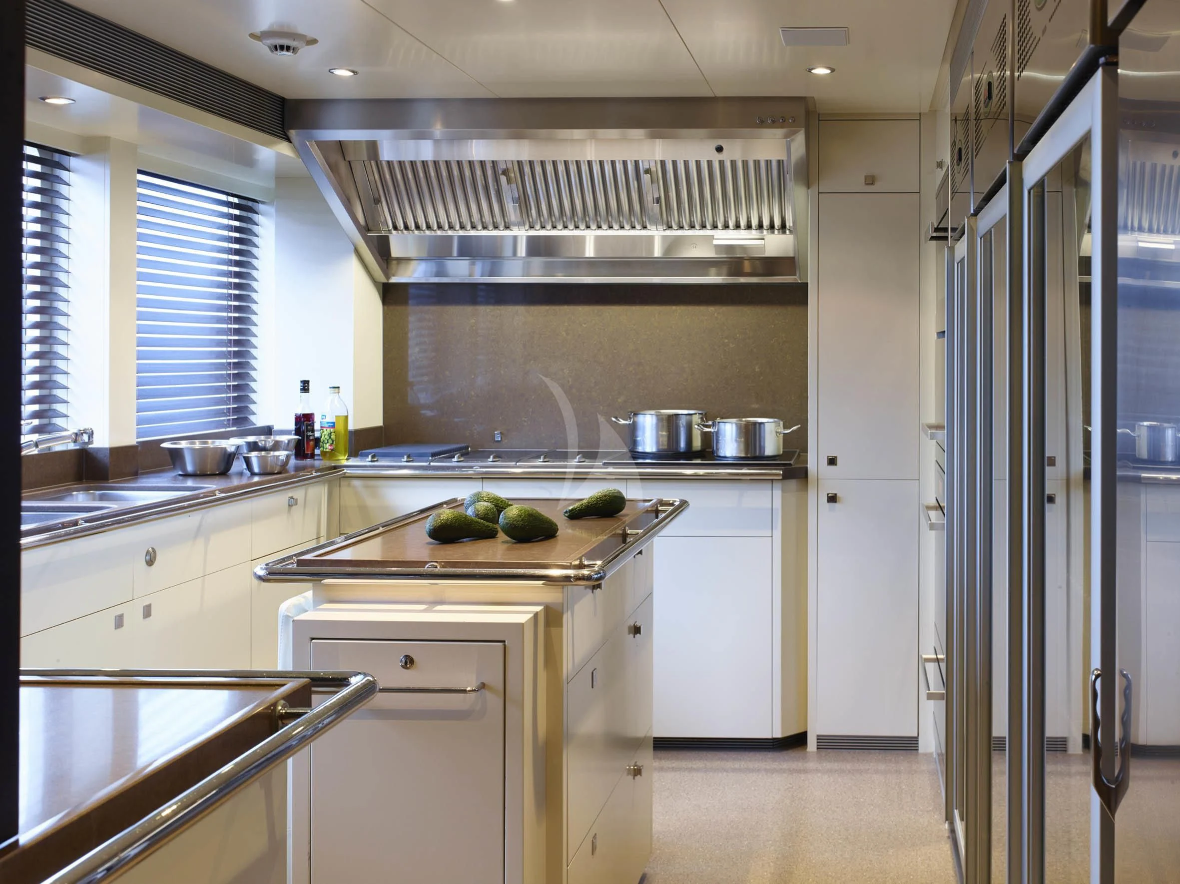 a kitchen with a stainless steel stove aboard ROCKET Yacht for Sale